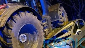 Three people taken to hospital after car crushed under tractor