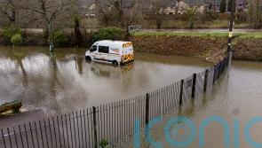 Roads submerged amid flood warnings across parts of UK