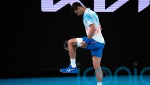Djokovic taking hamstring injury ‘day to day’ as he progresses in Melbourne