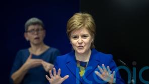 Sturgeon condemns placards at rally against blocking of gender reforms