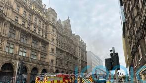 Firefighter in critical condition after blaze at former department store