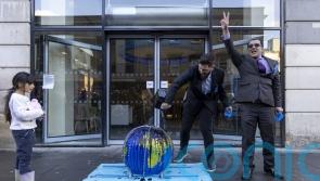 Climate activists protest outside Barclays offices in Glasgow