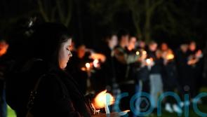 Candlelit vigil held for girl, four, who was mauled to death by pet dog