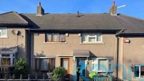 Woman arrested after three children, including baby, found with stab injuries
