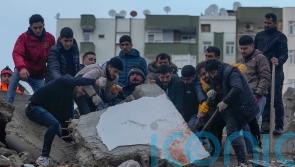 Survivors scream as rescuers battle to free them from earthquake debris
