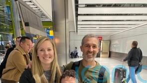 Athlete who completed endurance challenge in wheelchair returns to UK