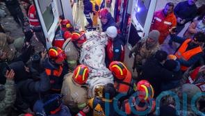 Rescuers find five members of single family alive in rubble days after quake