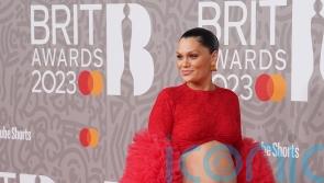 Jessie J bares her baby bump on the Brit Awards red carpet