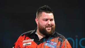 Michael Smith beats Dimitri Van den Bergh to move top of Premier League table