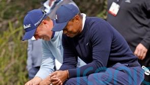 Tiger Woods gives tampon to playing partner Justin Thomas after outdriving him