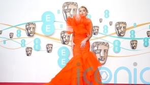 Florence Pugh&rsquo;s bright orange dress leads charge of colourful outfits at Baftas