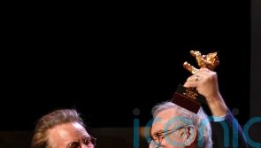 Bono presents Steven Spielberg with lifetime award at Berlin film festival