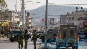 Israeli settlers go on violent rampage after Palestinian gunman kills two