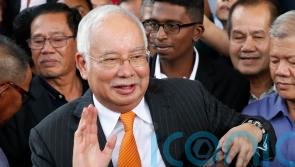 Former PM acquitted in latest trial over embezzlement of Malaysian state fund