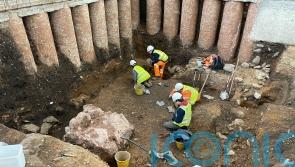 Evidence of Roman shrine uncovered during archaeological dig in graveyard