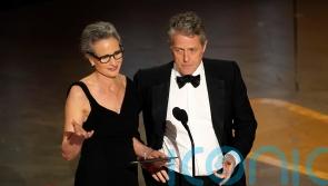 Hugh Grant presents award with Andie MacDowell after ‘awkward’ Oscars interview