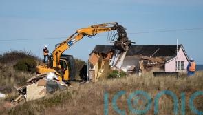 Rock defences being built to slow coastal erosion after homes demolished