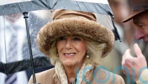 Queen Consort enjoys day at the races despite the drizzle