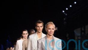 Pamela Anderson and Naomi Campbell walk the Miami runway for Hugo Boss