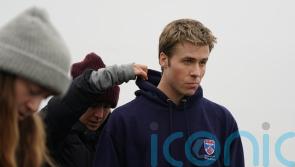 The Crown actor spotted jogging through St Andrews as filming continues