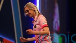 Fallon Sherrock becomes first woman to hit nine-dart finish in PDC event