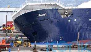 Emergency services at scene after ship topples in dry dock