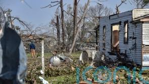 Biden declares emergency as crews dig through Deep South tornado wreckage