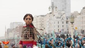 Giant puppet Little Amal leads walk in Brighton to raise awareness of refugees
