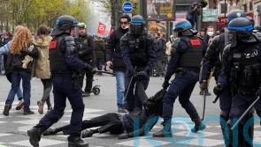 French police fire tear gas at protesters amid new strikes over pension reforms
