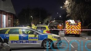 Man arrested on suspicion of murder after fire at flats in east London