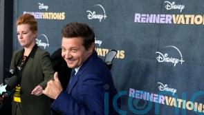 Jeremy Renner uses scooter and cane on first red carpet since snowplough injury