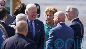 Joe Biden shares laugh with priest as he tours Catholic pilgrimage site