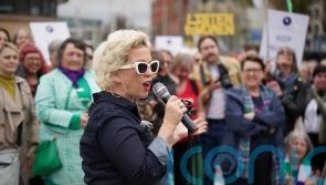Police form line between rival transgender debate demos in Belfast