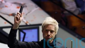 Former champion Neil Robertson reaches round two at Crucible by beating Wu Yize