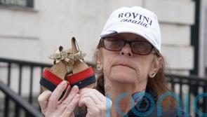 Bereaved family members lay shoes of loved ones in protest against legacy Bill