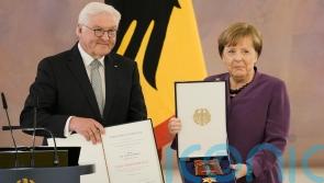 Ex-leader Angela Merkel decorated with highest German honour