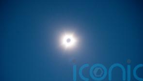 Thousands gather to enjoy spectacle of rare hybrid solar eclipse