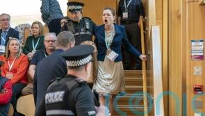 Climate campaigners stage protest in Holyrood chamber despite new restrictions