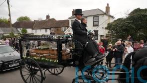 Coffin arrives at funeral of Paul O’Grady as hundreds line streets