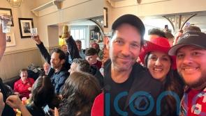 Paul Rudd drinks beer and sings chants with fans at Wrexham pub