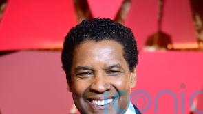 Denzel Washington accepts Lifetime Achievement award on CinemaCon opening night