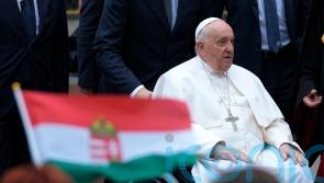 Pope urges Hungary to show charity to all as he visits refugees
