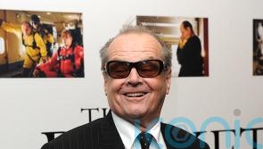 Jack Nicholson hugs LeBron James at NBA game