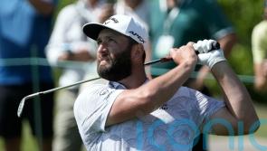 Jon Rahm shoots course record as title defence hots up