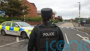 Man charged after crash close to Belfast police station