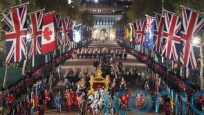 Early morning coronation rehearsal featuring state coaches staged in London