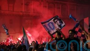 Napoli’s fans light up the sky as they celebrate Serie A title win