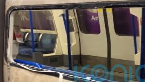 Passengers climb out of smashed windows at Tube station amid smoke emergency