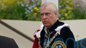 Andrew wears Garter robes in apparent softening of family stance