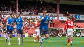 Peterborough book play-off place with victory at Barnsley